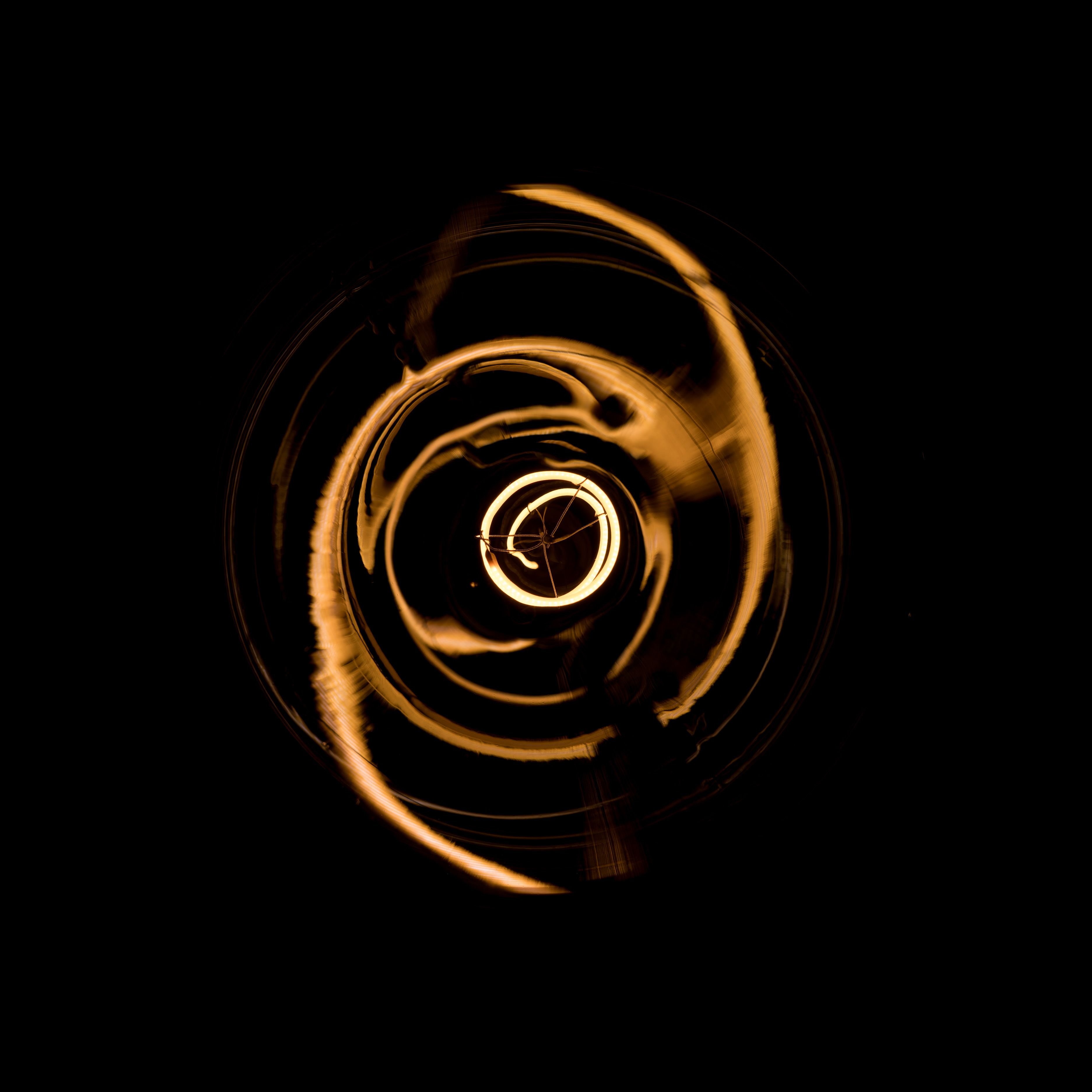 light bulbed photographed from below against a black background